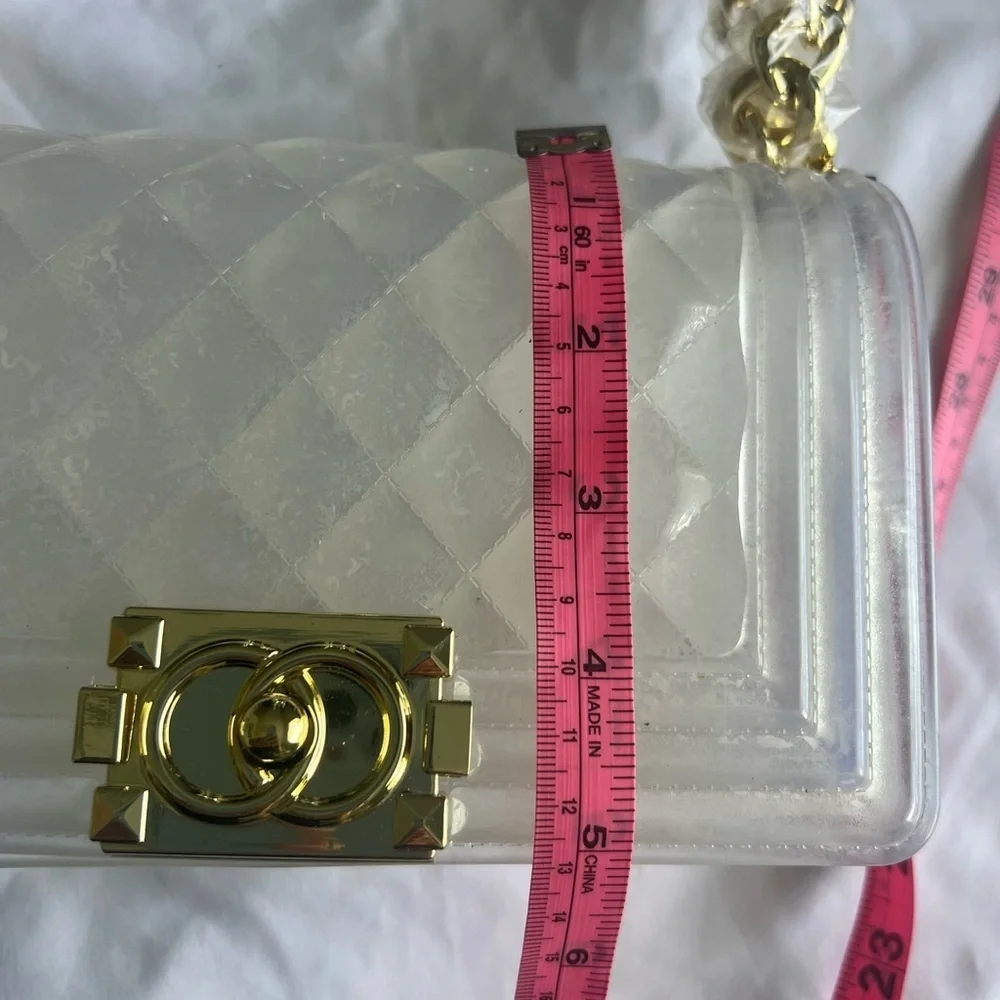 Elegant transparent padded bag with golden details are two bags for only 35